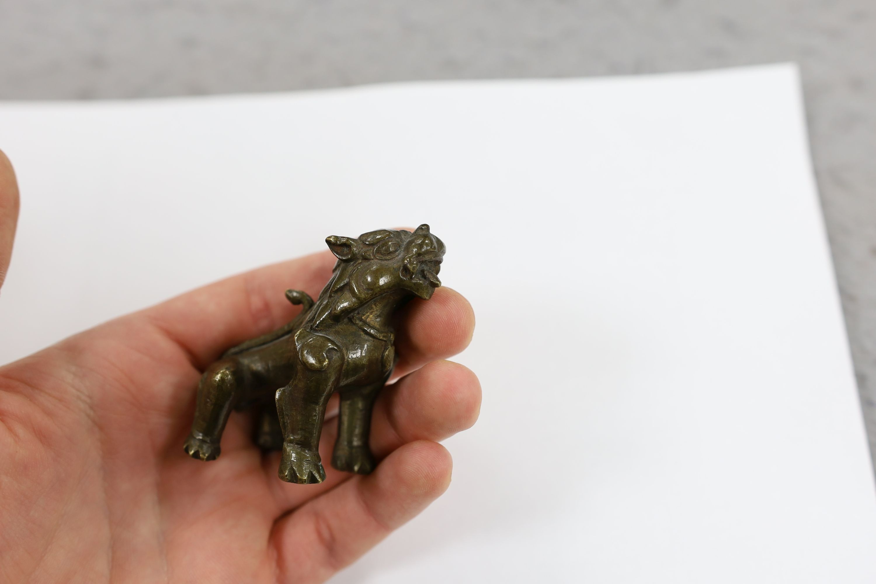 Five Chinese or Tibetan bronze figures or Buddhist implements, tallest 13cms high